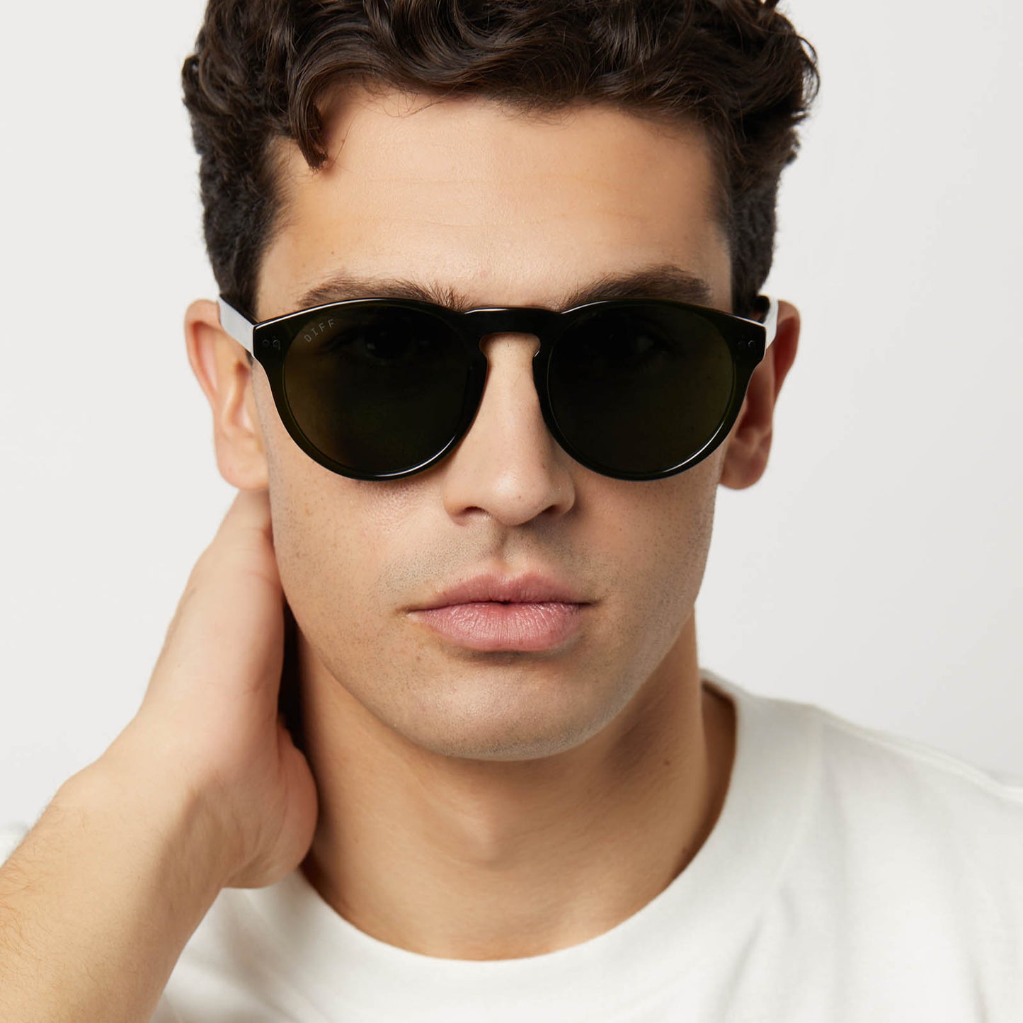 on model - male wearing diff eyewear featuring the cody xl round sunglasses with a dark olive crystal frame and g15 polarized lenses front view