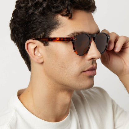 on model - male wearing diff eyewear featuring the cody xl round sunglasses with a rich tortoise frame and brown polarized lenses side view