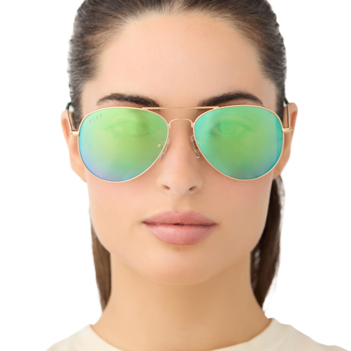 on model - female wearing diff eyewear cruz aviator sunglasses with a gold metal frame and green mirror polarized lenses front view