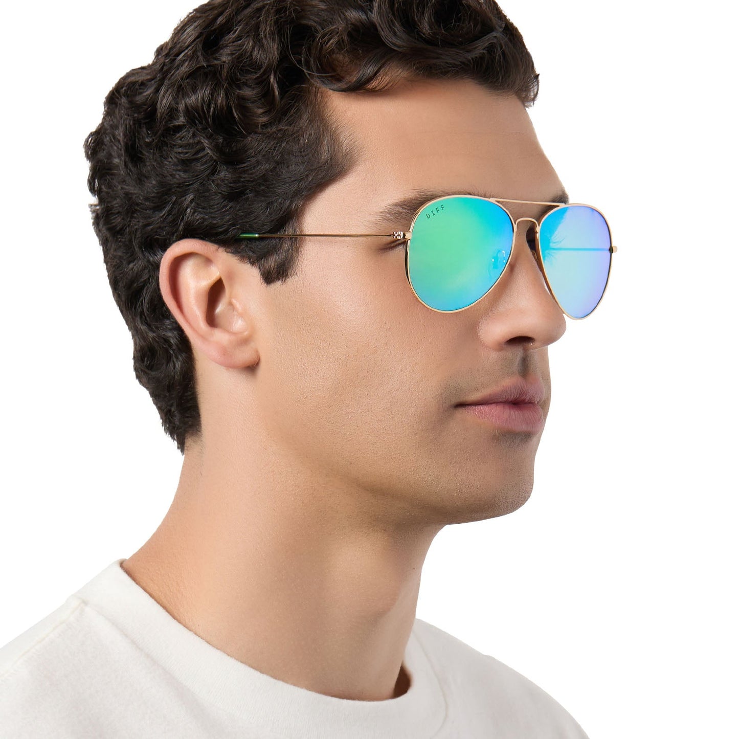 on model - male wearing diff eyewear cruz aviator sunglasses with a gold metal frame and green mirror polarized lenses angled view