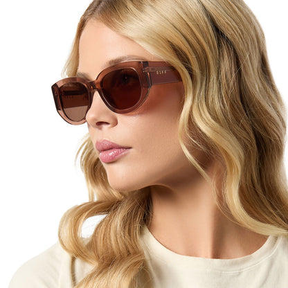 on model - female wearing diff eyewear drew square sunglasses with a cafe ole brown acetate frame and brown lenses angled view