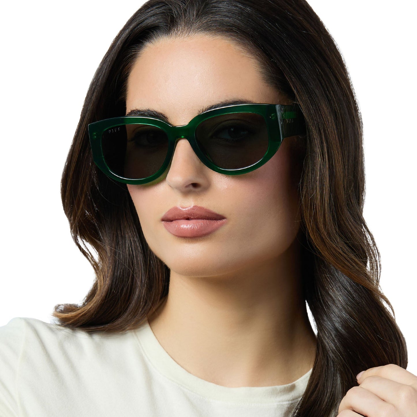 on model - female wearing diff eyewear drew square sunglasses with a palm green crystal acetate frame and grey polarized lenses angled view