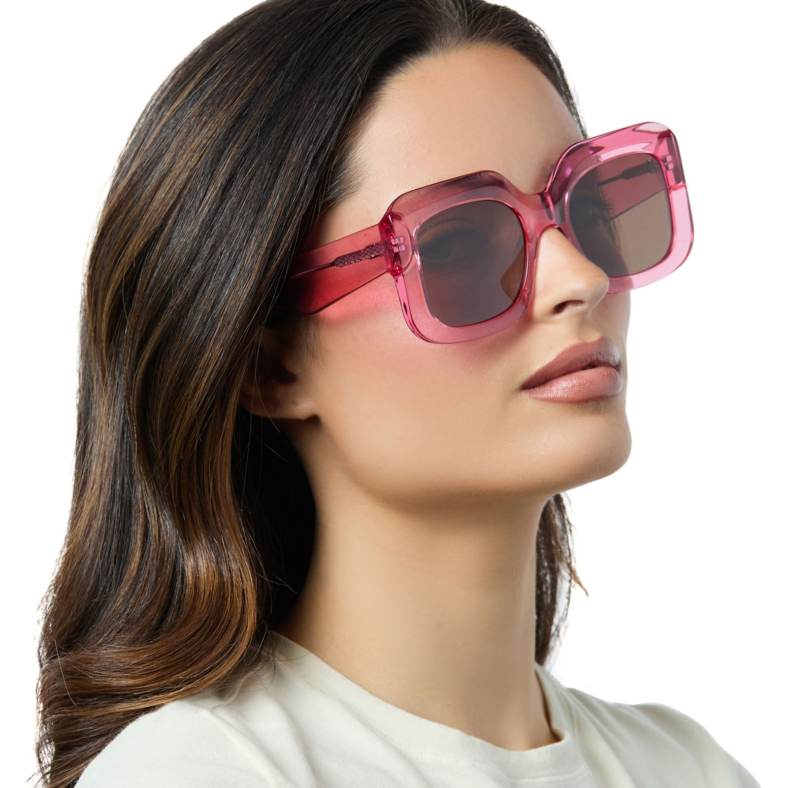 on model - female wearing diff eyewear giada oversized square sunglasses with a candy pink crystal acetate frame and brown lenses angled view