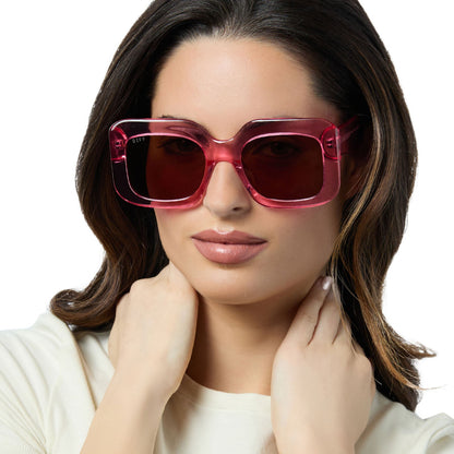 on model - female wearing diff eyewear giada oversized square sunglasses with a candy pink crystal acetate frame and brown lenses front view