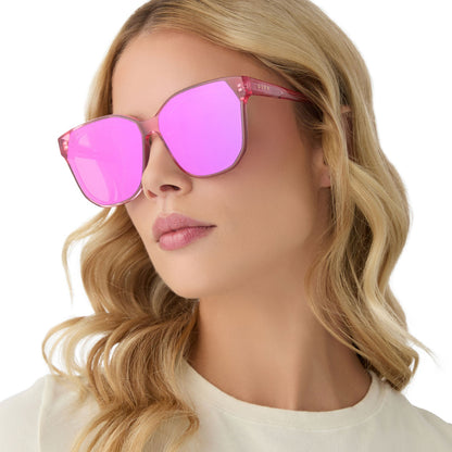 on model - female wearing diff eyewear gia oversized square sunglasses with a candy pink crystal acetate frame and pink rush mirror lenses angled view