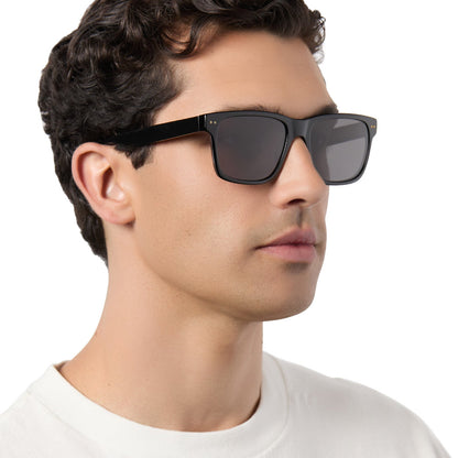 on model - male wearing diff eyewear gino xl square sunglasses with a black acetate frame and grey polarized lenses angled view