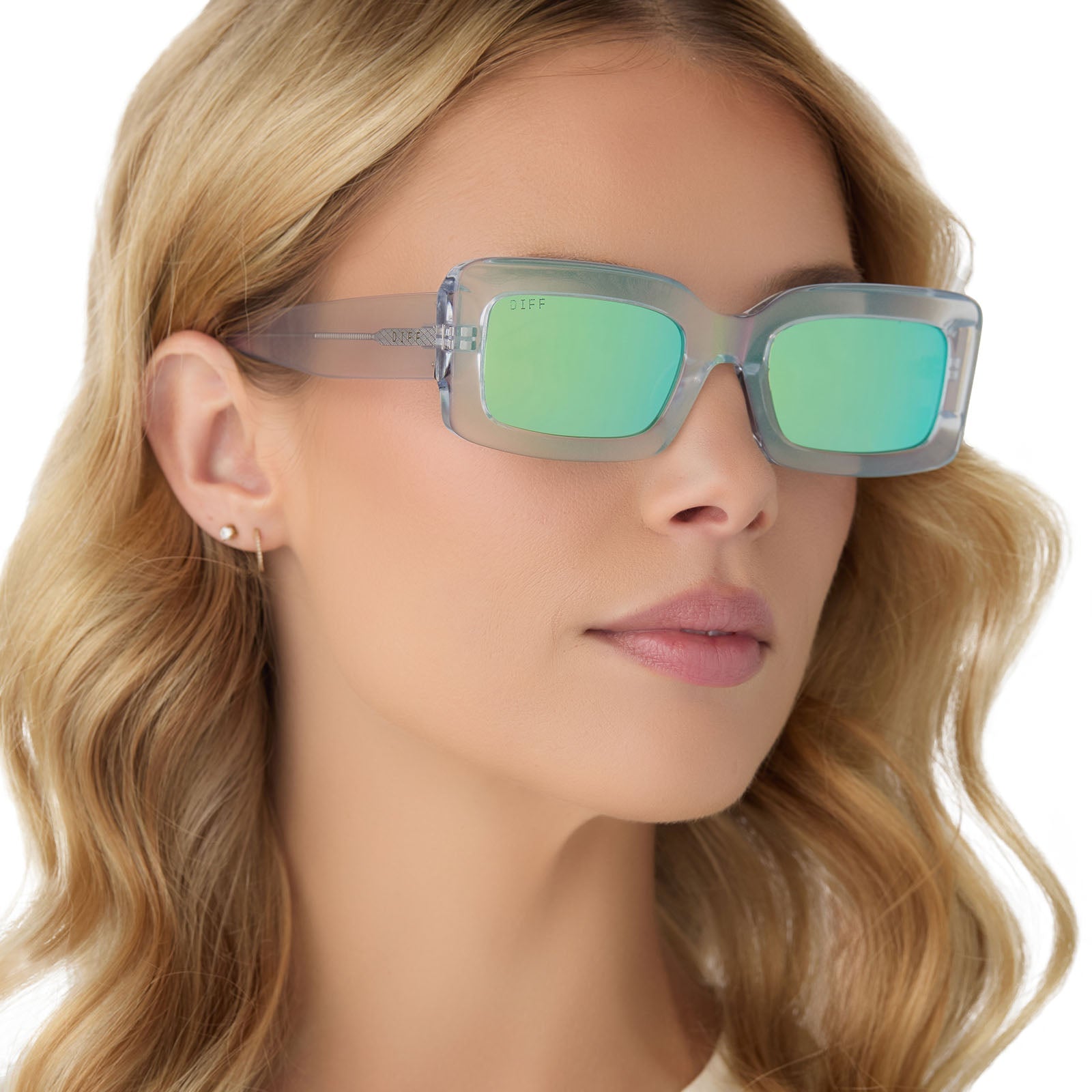 on model - female wearing diff eyewear indy square sunglasses with a opalescent turquoise frame and turquoise ice lenses angled view