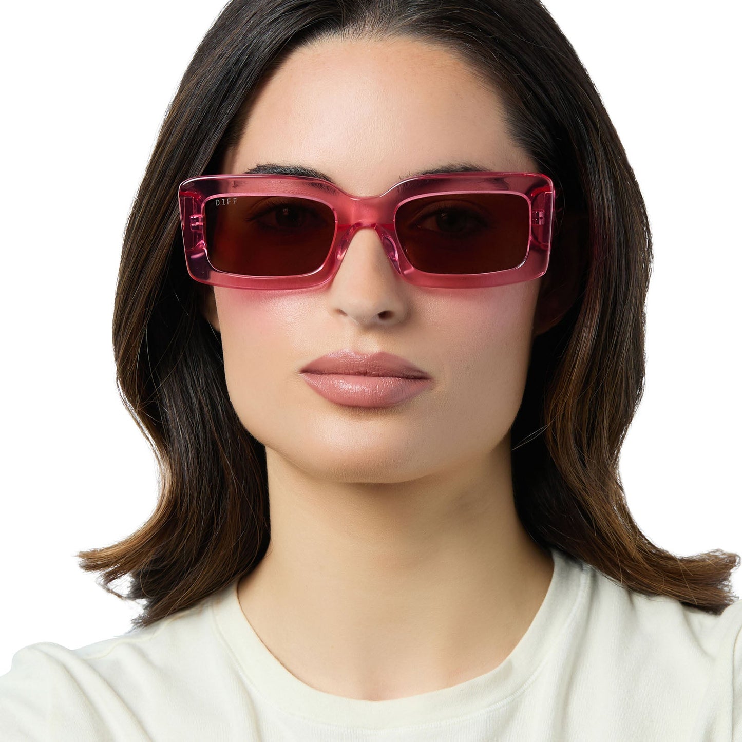 on model - female wearing diff eyewear indy square sunglasses with a candy pink crystal frame and brown lenses front view