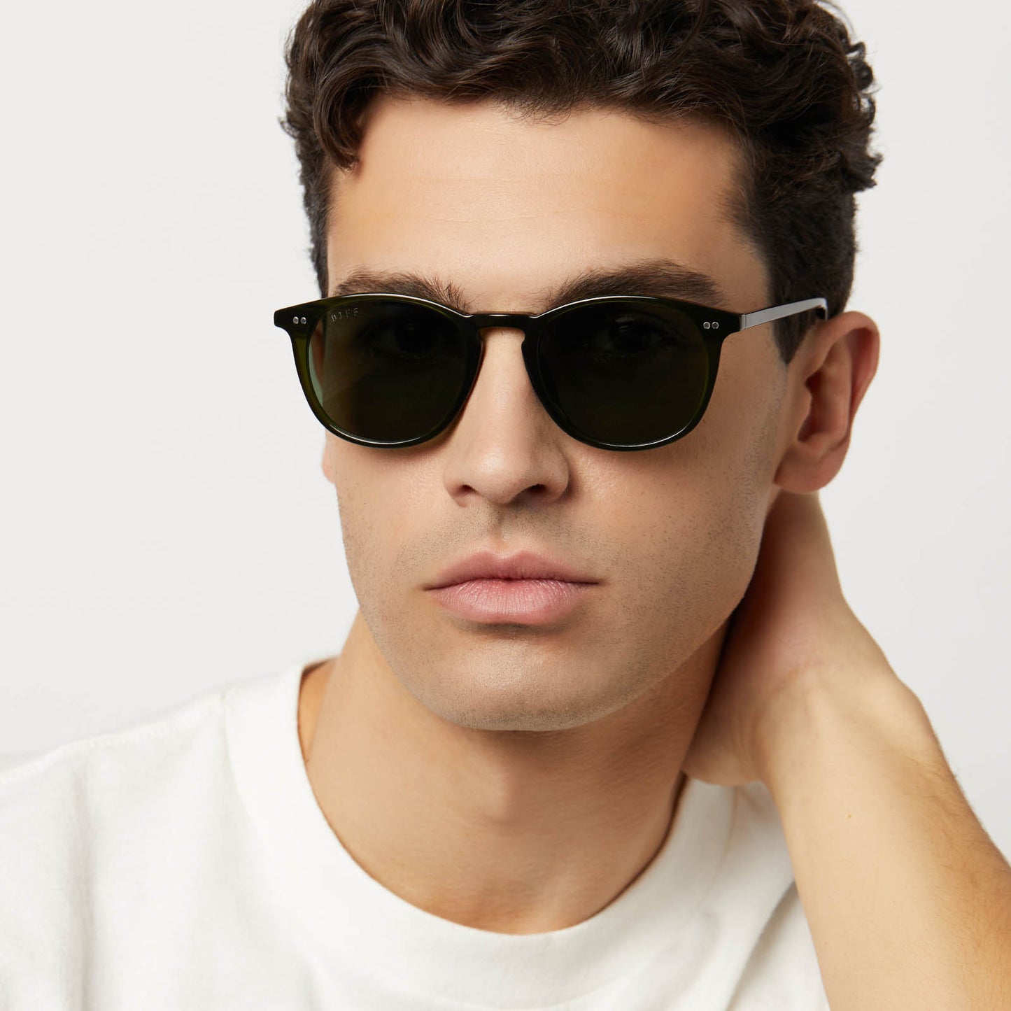 on model - male wearing diff eyewear featuring the jaxson xl square sunglasses with a dark olive crystal frame and g15 polarized lenses front view