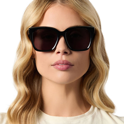 on model - female wearing diff eyewear meredith square sunglasses with a black acetate frame and grey lenses front view