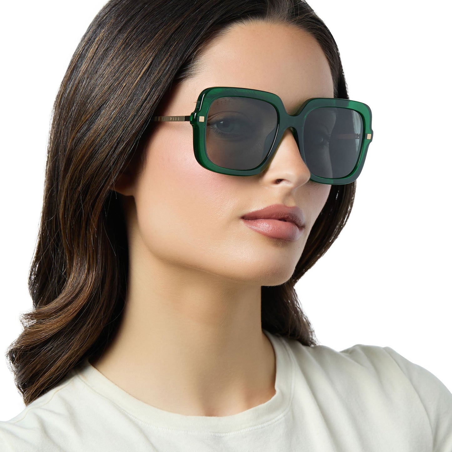 on model - female wearing diff eyewear sandra square oversized sunglasses with a palm green crystal acetate frame and grey lenses side view