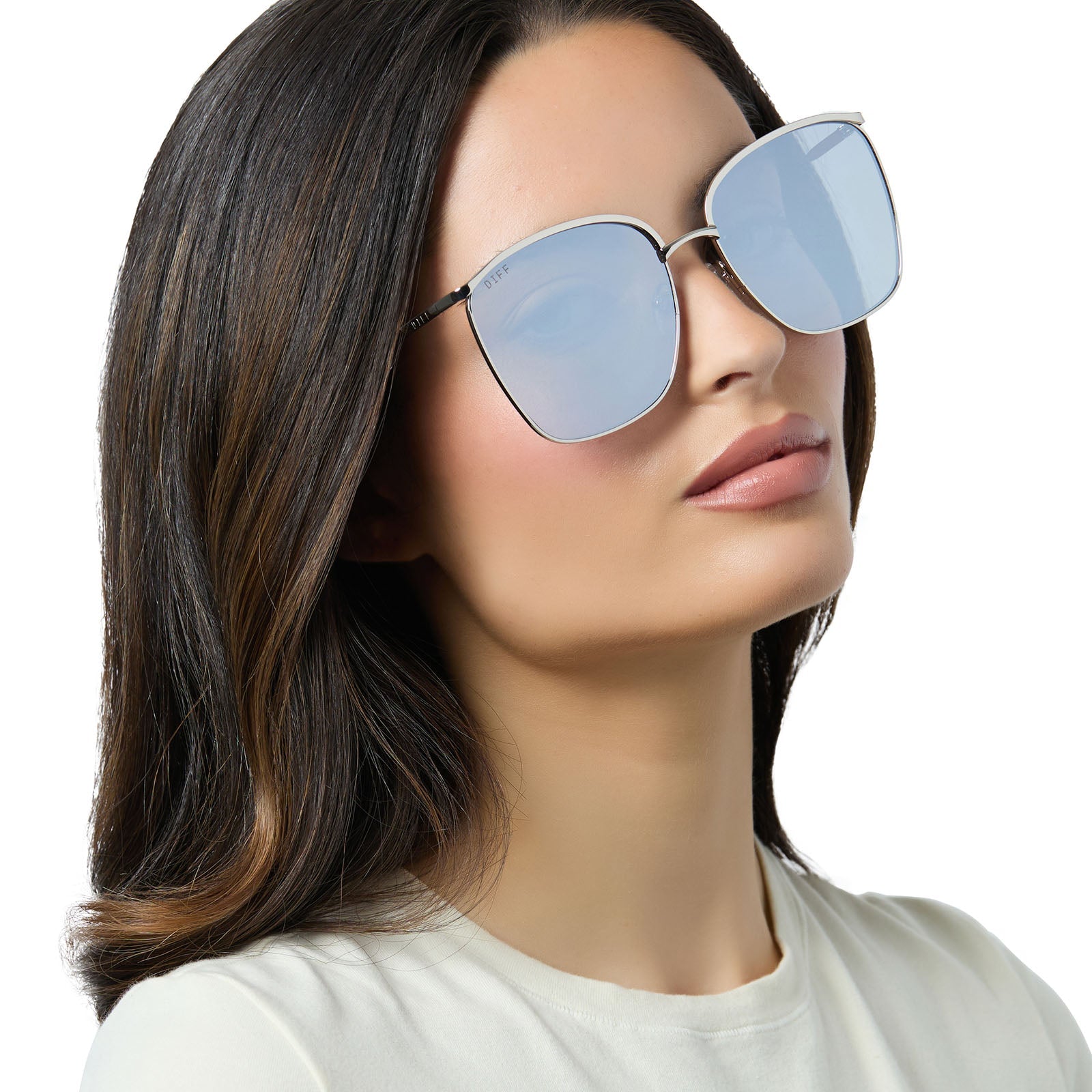 on model - female wearing diff eyewear vittoria square oversized sunglasses with a silver metal frame and silver mirror lenses angled view