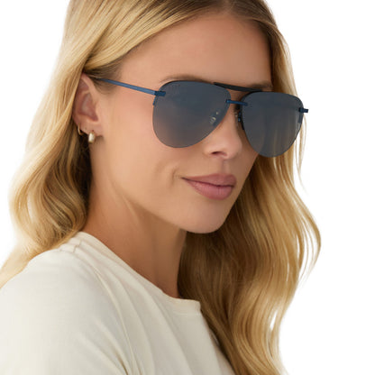 on model - female wearing diff eyewear featuring the tahoe aviator sunglasses with a deep navy metal frame and aegean blue flash polarized lenses angled view