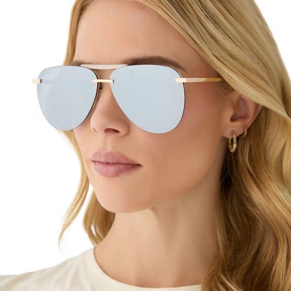 on model - female wearing diff eyewear featuring the tahoe aviator sunglasses with a gold frame and silver chrome mirror lenses side view