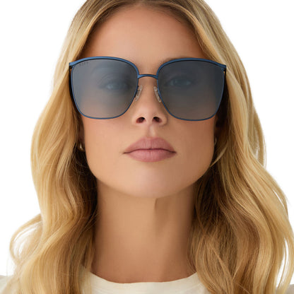 on model - female wearing diff eyewear featuring the vittoria square sunglasses with a deep navy metal frame and aegean blue flash polarized lenses front view