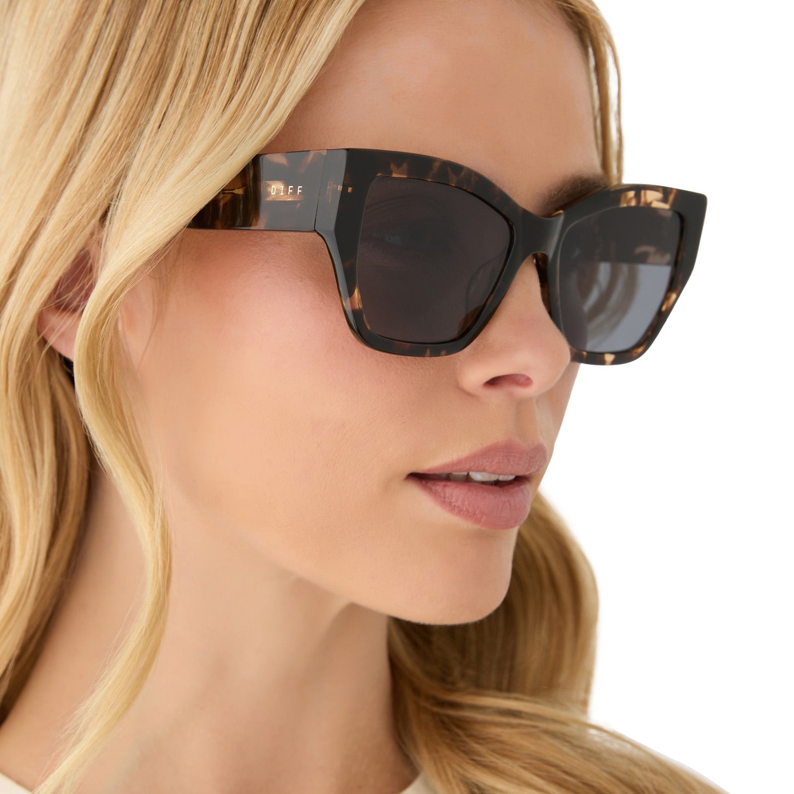 on model - female wearing diff eyewear featuring the vivienne cat eye sunglasses with a espresso tortoise frame and grey polarized lenses side view