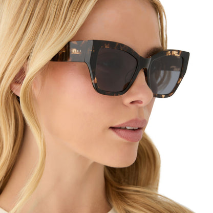 on model - female wearing diff eyewear featuring the vivienne cat eye sunglasses with a espresso tortoise frame and grey polarized lenses side view