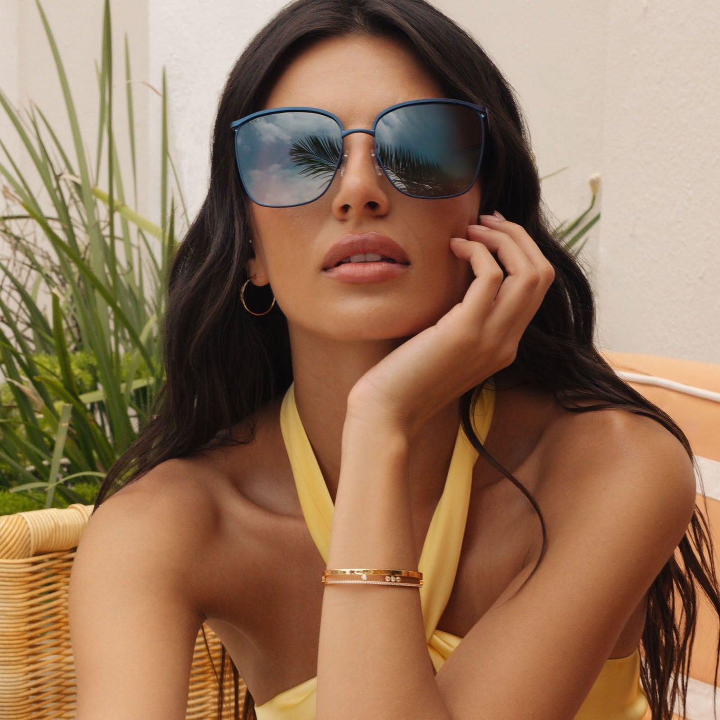 on model - female wearing diff eyewear featuring the vittoria square sunglasses with a deep navy metal frame and aegean blue flash polarized lenses front view