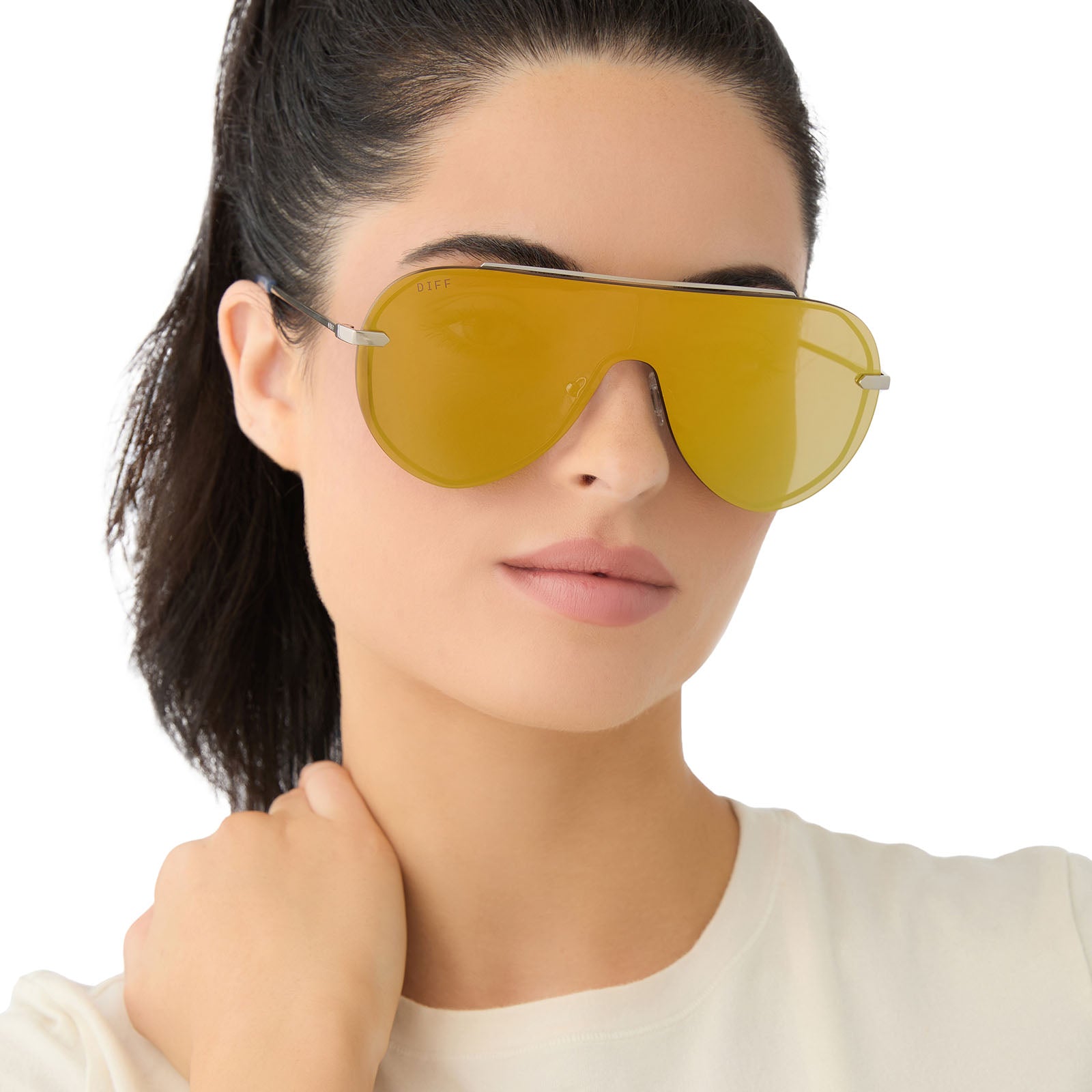 on model - female wearing diff eyewear imani shield sunglasses with a silver frame and gold mirror lenses front view