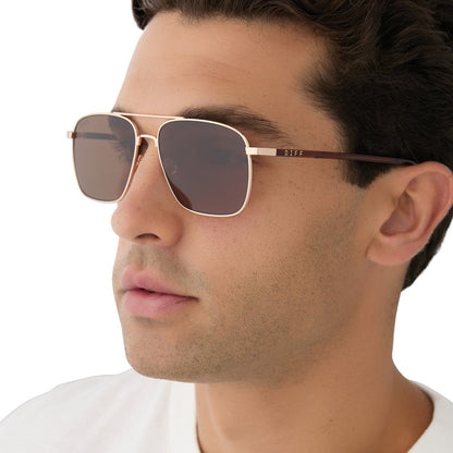 on model - male wearing diff eyewear yellowstone rip wheeler sunglasses gold & brown angled view