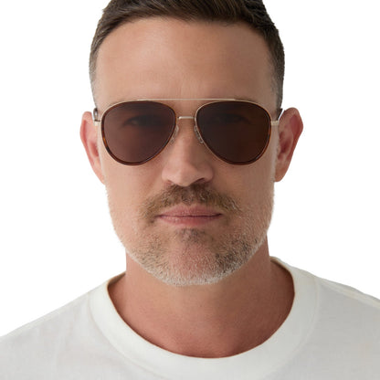 on model - male wearing yellowstone x diff eyewear featuring the yellowstone aviator sunglasses with a sequoia tortoise frame and brown polarized lenses front view
