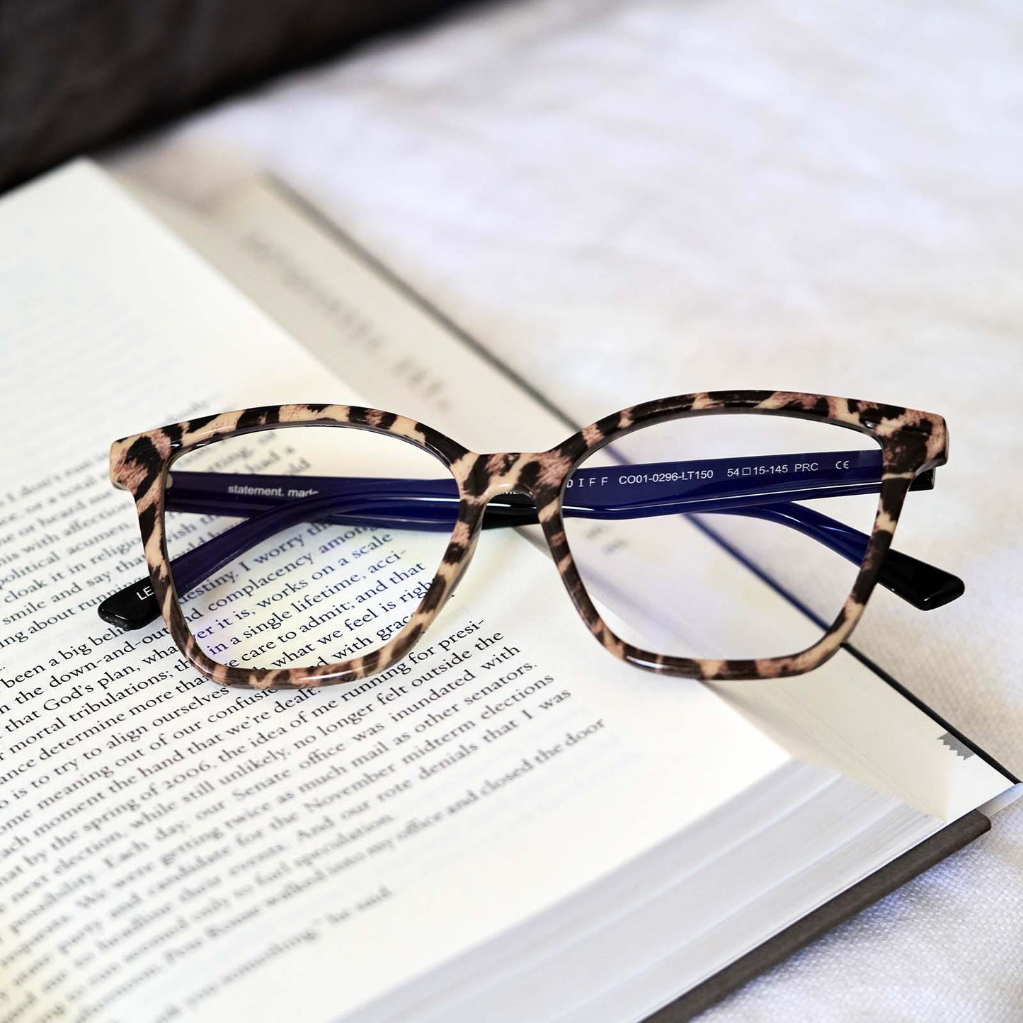 LEAH - LEOPARD TORTOISE + BLUE LIGHT READERS flatlay