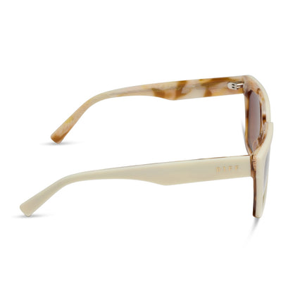 diff eyewear featuring the amara square sunglasses with a courtside ivory outside with gilded tortoise inside the frame and brown gradient polarized lenses side view