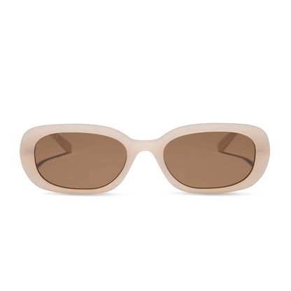 aspyn ovard x diff eyewear featuring the cove oval sunglasses with a milky blush frame and brown lenses front view