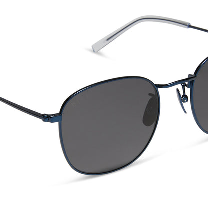 diff eyewear featuring the axel round sunglasses with a deep navy metal frame and grey polarized lenses detailed view