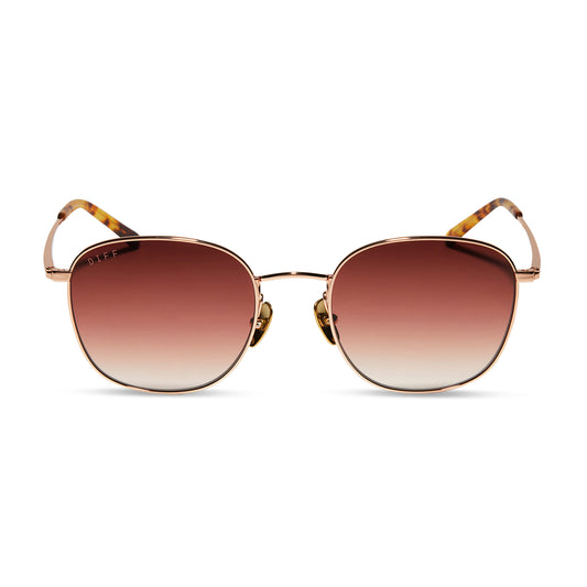 diff eyewear axel round sunglasses with a rose gold frame and dusk gradient lenses front view