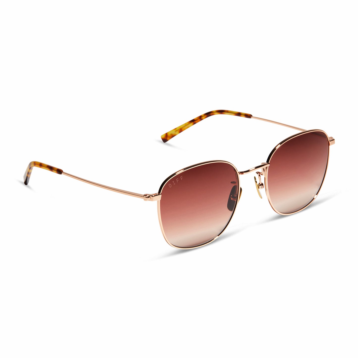 diff eyewear axel round sunglasses with a rose gold frame and dusk gradient lenses angled view