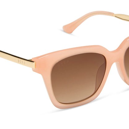 diff eyewear featuring the bella xs square sunglasses with a peach frame and brown polarized lenses detailed view