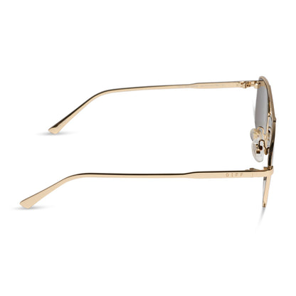 diff eyewear featuring the charley navigator sunglasses with a gold metal frame and brown polarized lenses side view