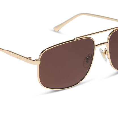 diff eyewear featuring the charley navigator sunglasses with a gold metal frame and brown polarized lenses detailed view
