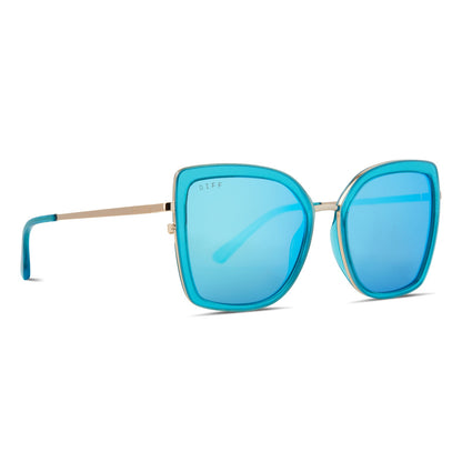 diff eyewear clarisse cat eye sunglasses with a turquoise ice crystal blue frame and gold metal legs and turquoise ice mirror lenses angled view