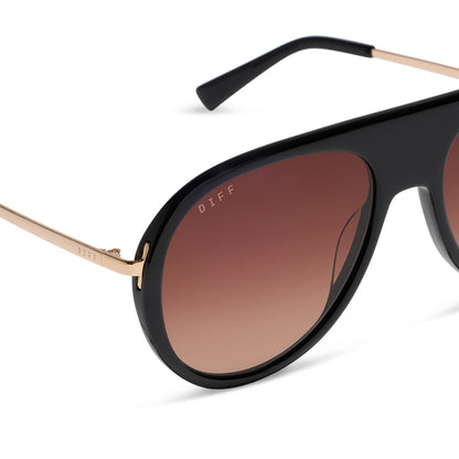 diff eyewear cleo oversized aviator sunglasses with a black frame, gold temples and brown gradient lenses detailed view