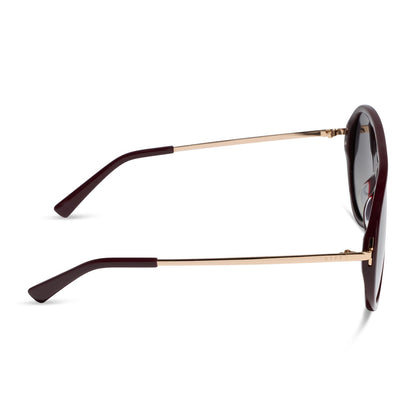 diff eyewear cleo oversized aviator sunglasses with a dark cherry lacquer red frame, gold temples and grey gradient polarized lenses side view