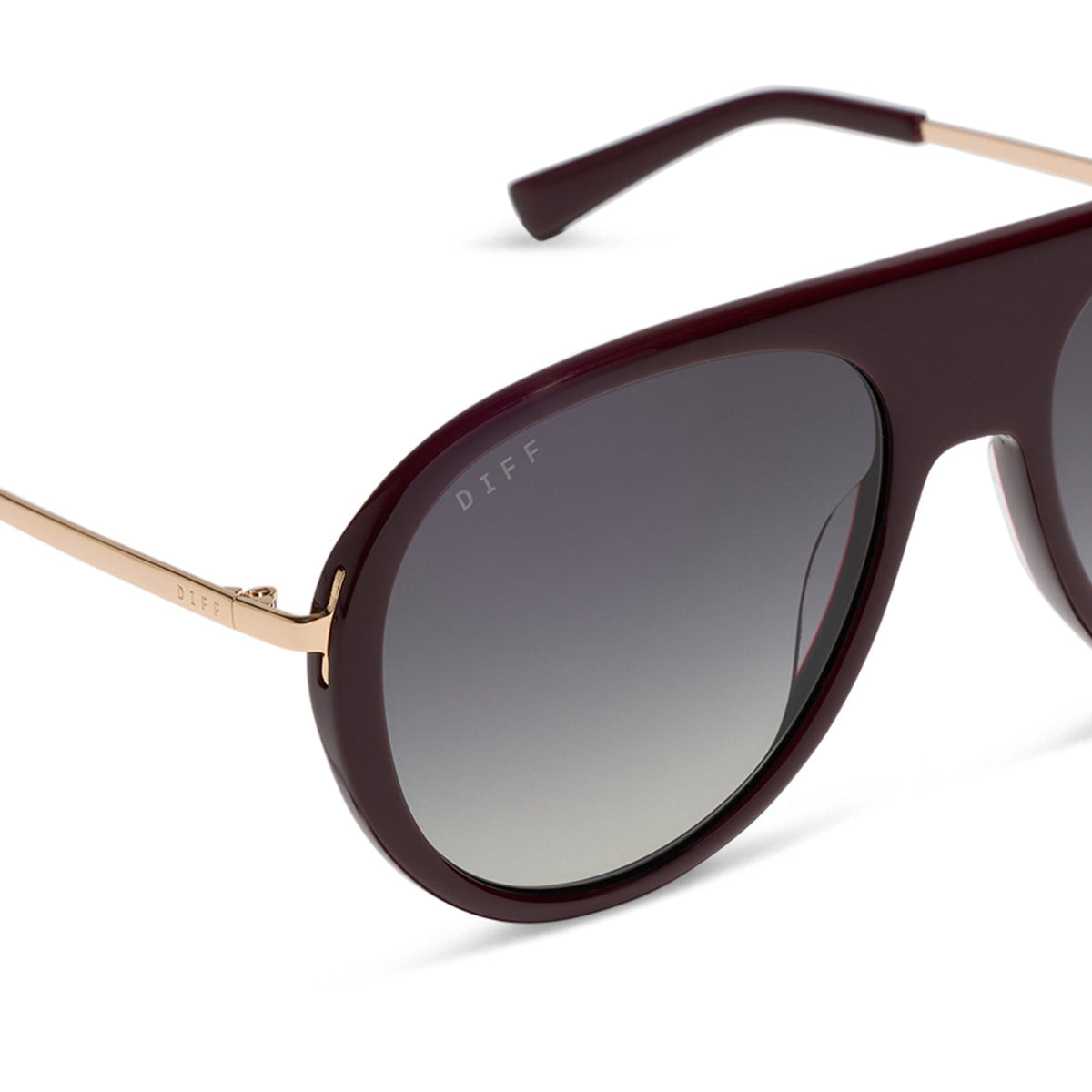 diff eyewear cleo oversized aviator sunglasses with a dark cherry lacquer red frame, gold temples and grey gradient polarized lenses detailed view