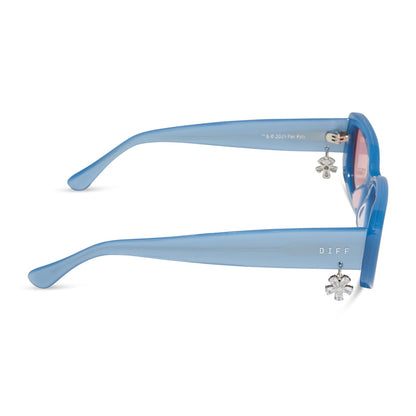 clueless x diff eyewear featuring the cher round sunglasses with a light blue frame and pink gradient lenses side view