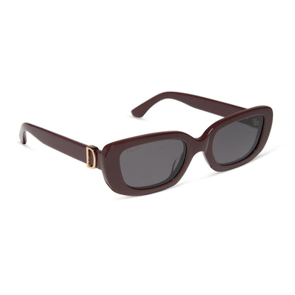 diff eyewear featuring the daphne rectangle sunglasses with a rugby red acetate frame and grey polarized lenses angled view
