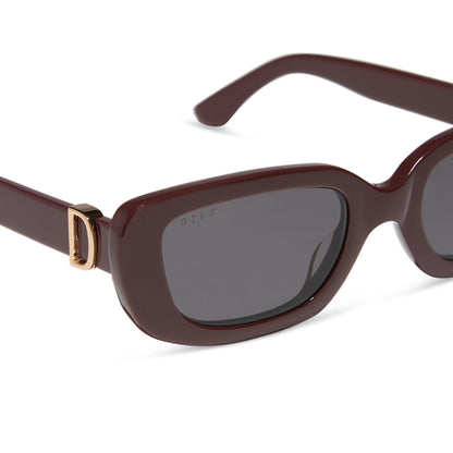 diff eyewear featuring the daphne rectangle sunglasses with a rugby red acetate frame and grey polarized lenses detailed view