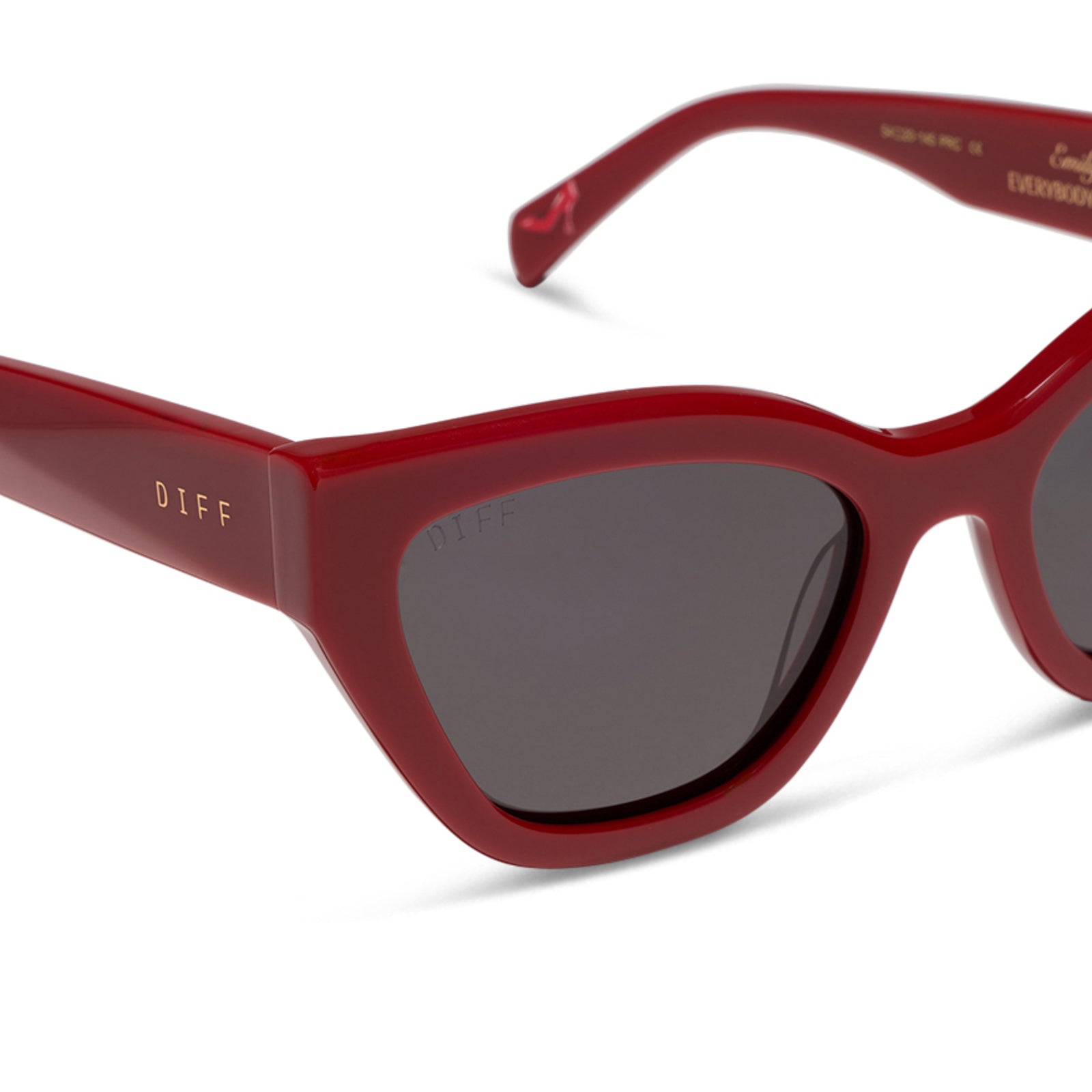 the devil wears prada x diff eyewear featuring the emily cat eye sunglasses with a red acetate frame and grey polarized lenses detailed view