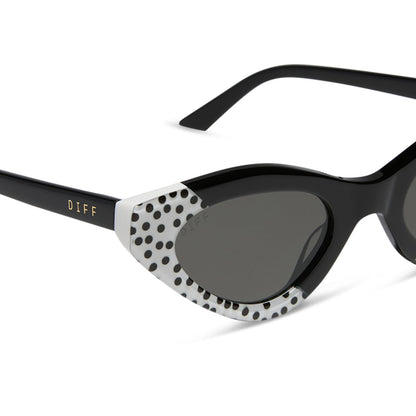 emily in paris x diff eyewear featuring the emily 2.0 cat eye sunglasses with a midnight polka dot frame and chic grey lenses detailed view