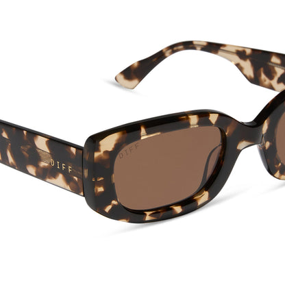 emily in paris x diff eyewear featuring the julien 2.0 rectangle sunglasses with a classic tortoise frame and warm brown lenses detailed view