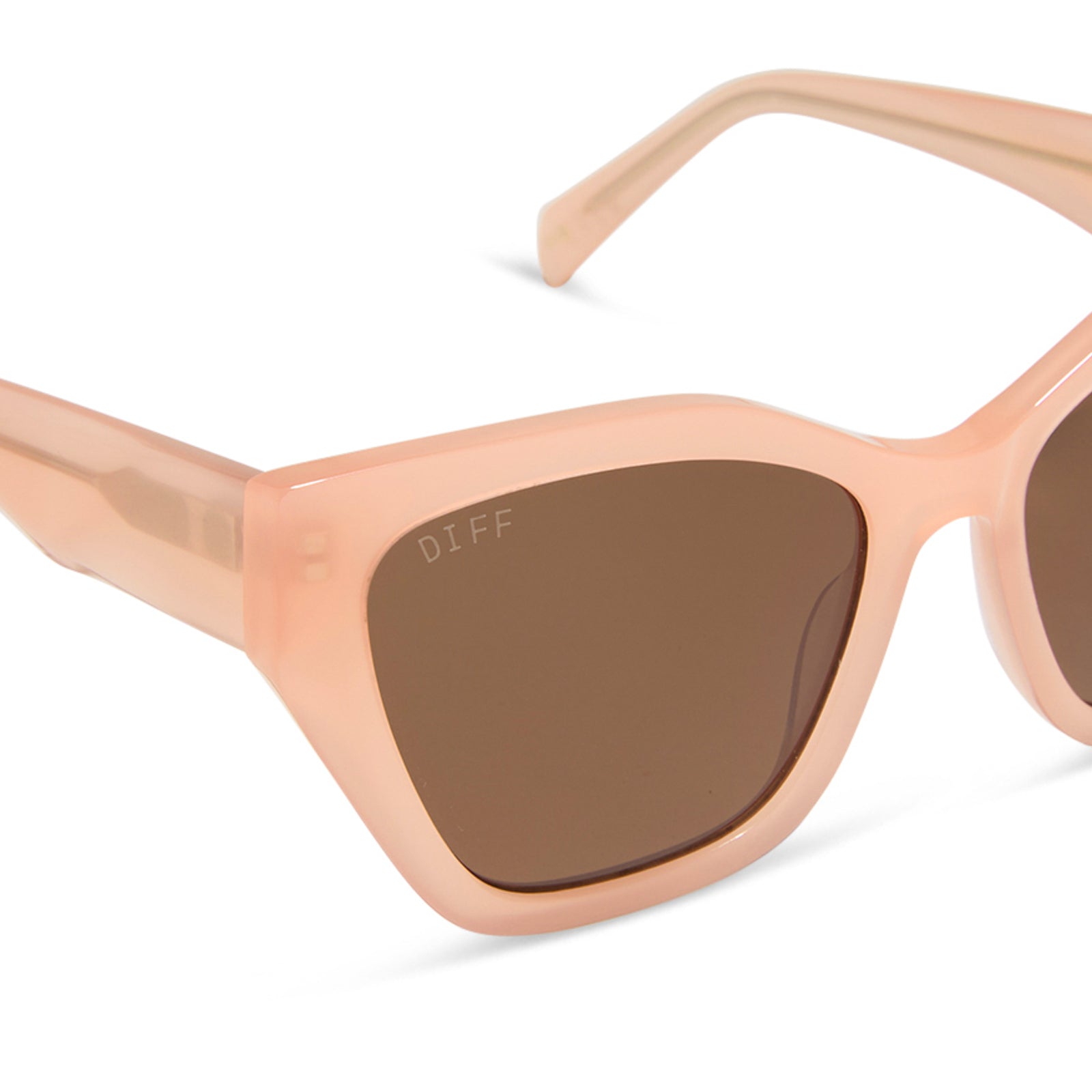diff eyewear featuring the evie cat eye sunglasses with a peach frame and brown polarized lenses detailed view
