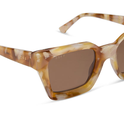 diff eyewear featuring the greer square sunglasses with a gilded tortoise frame and brown polarized lenses detailed view