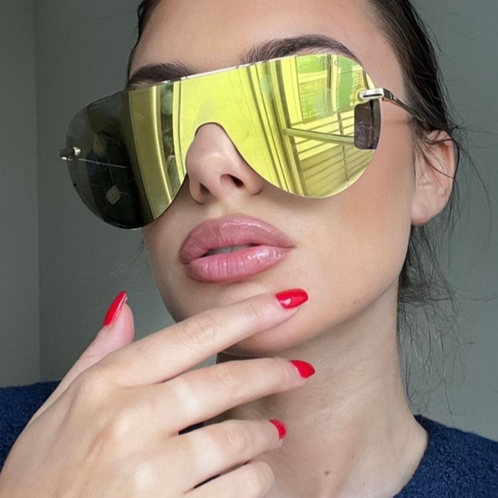 customer content - female wearing gold shield sunglasses