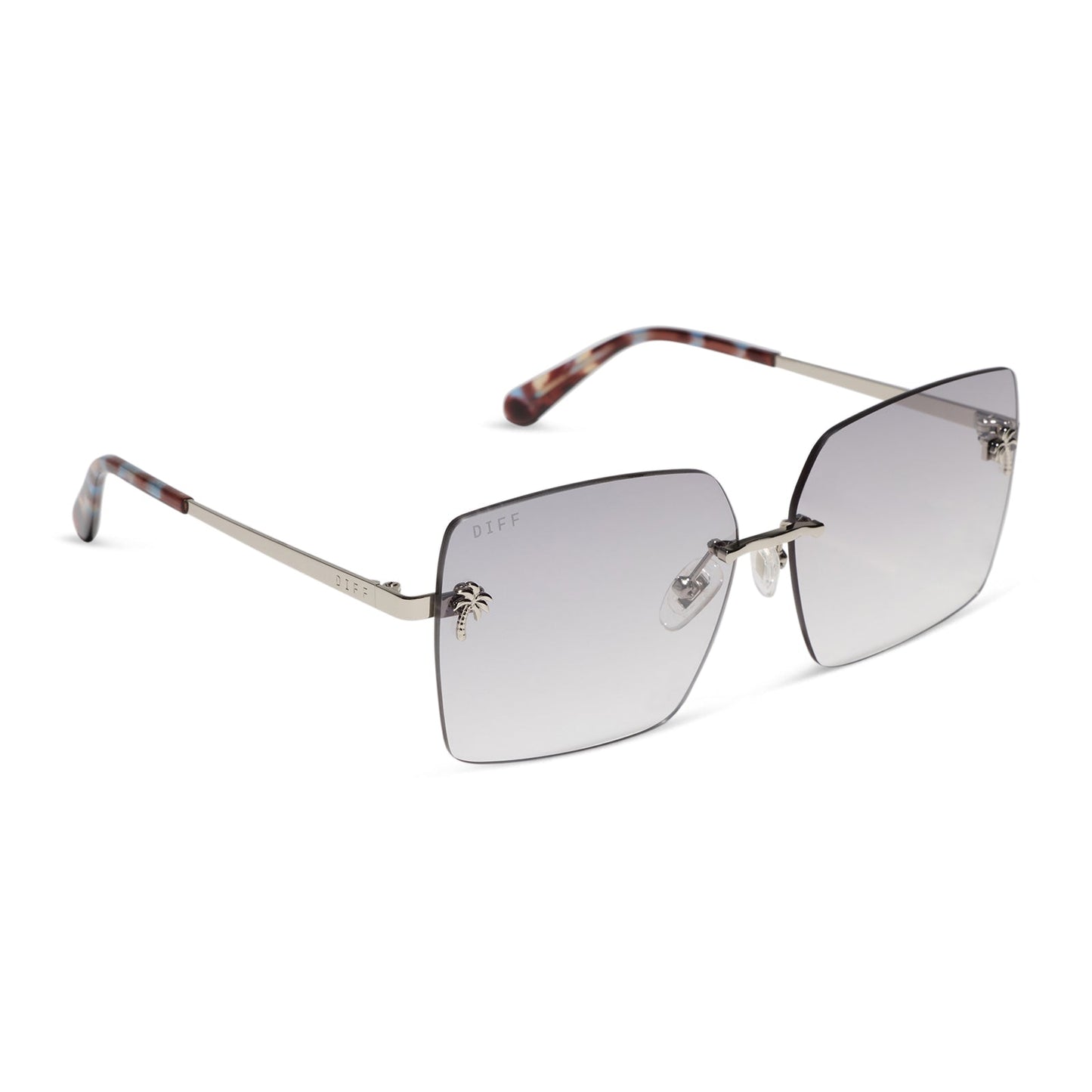 jena sims x diff eyewear featuring the rookie square sunglasses with a blue color pop and silver metal frame and sheer tint lenses angled view