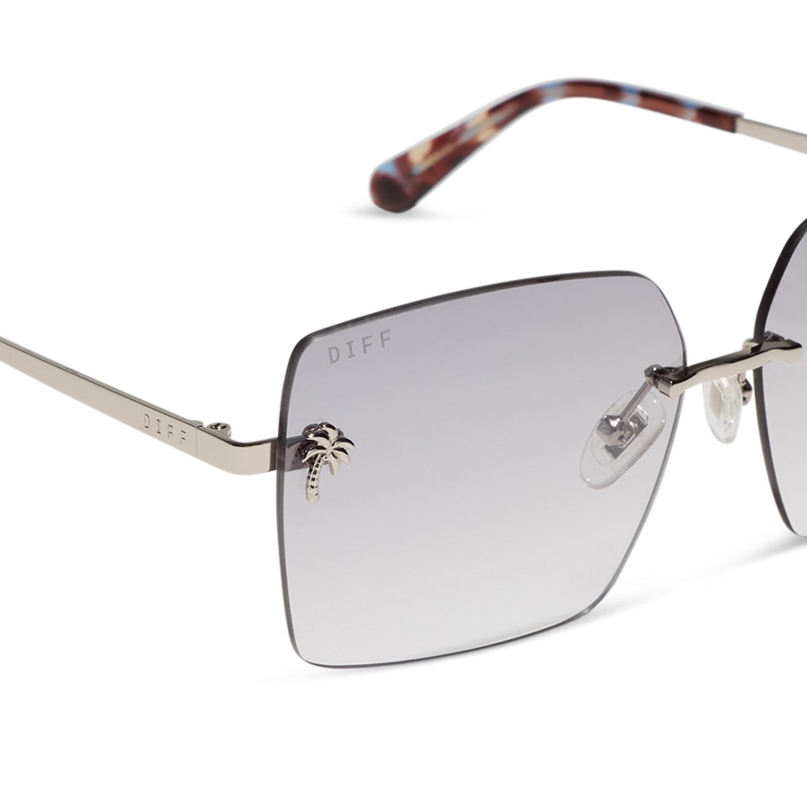 jena sims x diff eyewear featuring the rookie square sunglasses with a blue color pop and silver metal frame and sheer tint lenses detailed view