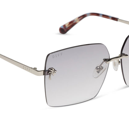 jena sims x diff eyewear featuring the rookie square sunglasses with a blue color pop and silver metal frame and sheer tint lenses detailed view